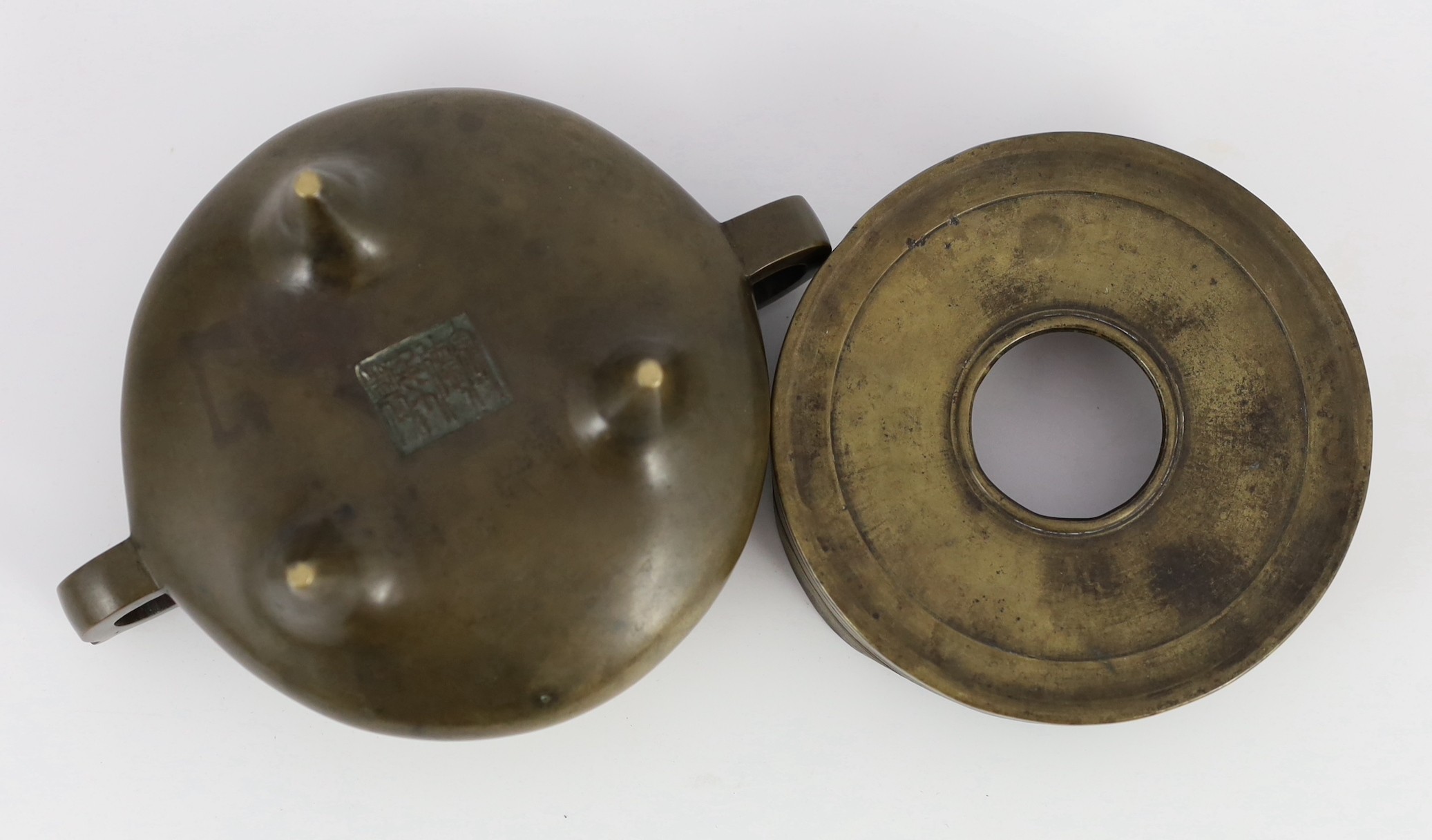 A Chinese bronze censer and stand, ding, 18th/19th century, 18.7cm wide, 11cm high